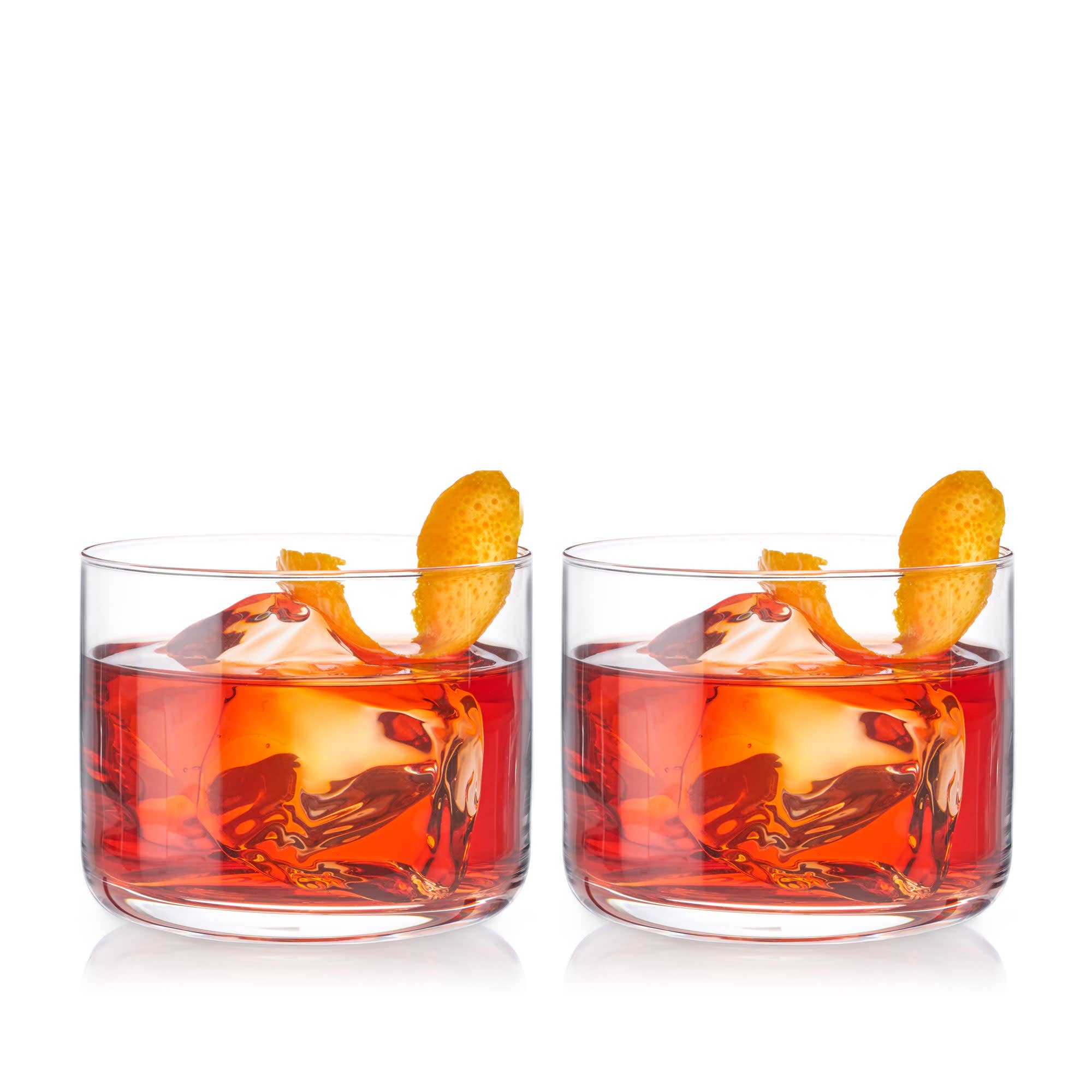 Two glasses of red cocktail with orange slices on a white background